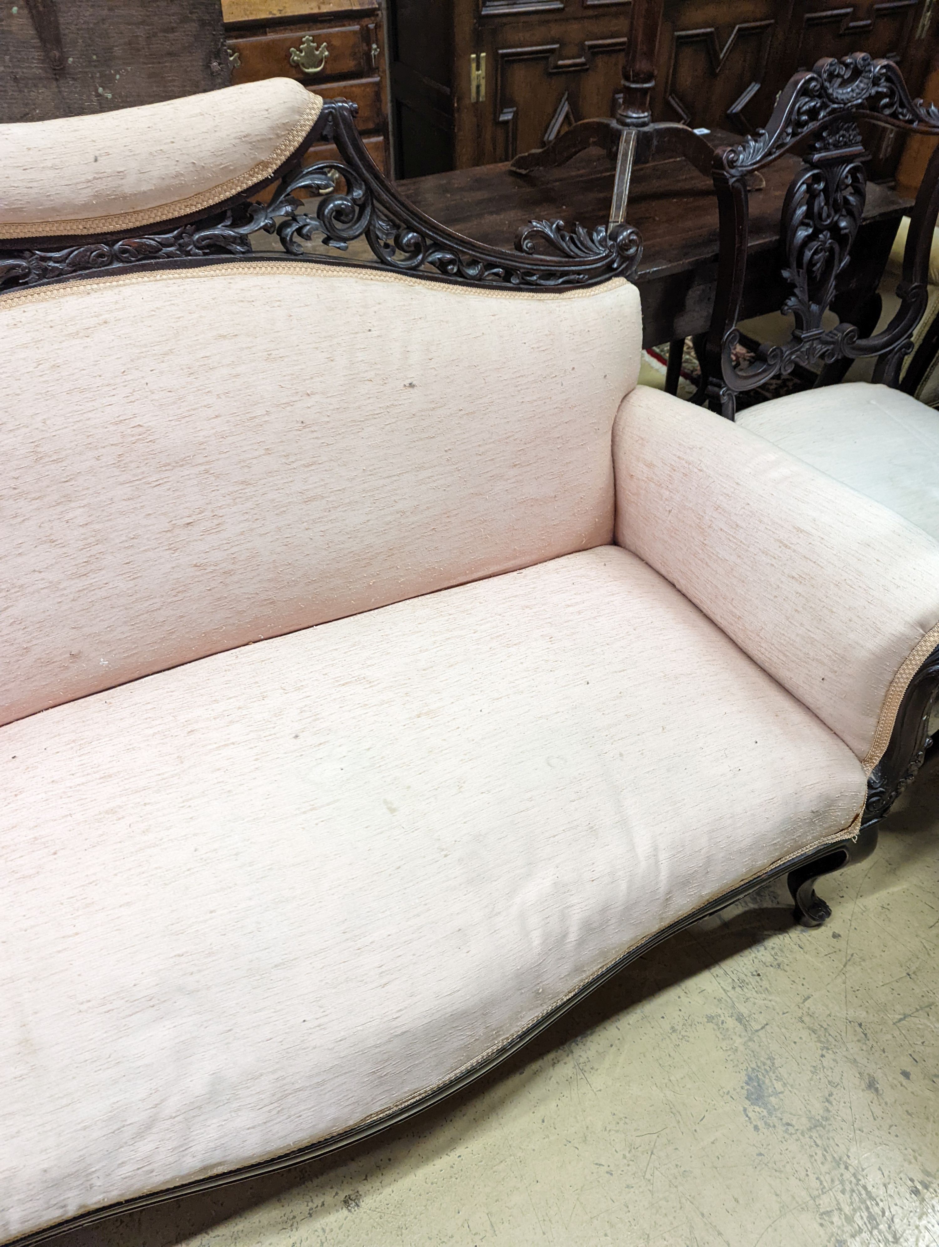 A late Victorian carved mahogany seven piece salon suite, settee length 140cm, depth 60cm, height 94cm